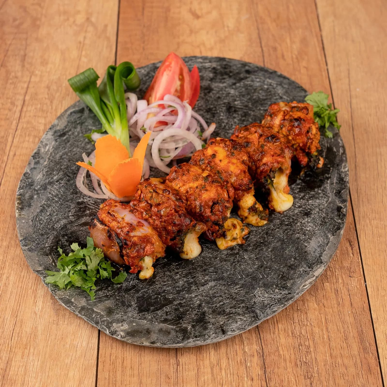 Chakra kebabs served on a slate platter